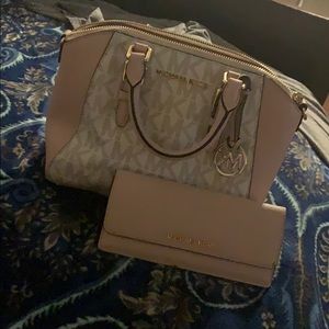 Pink Michael Kors handbag with matching wallet